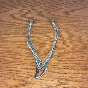 Chico’s 6-strand necklace with chunky Brooch in silver. EUC 10” long 5” extender